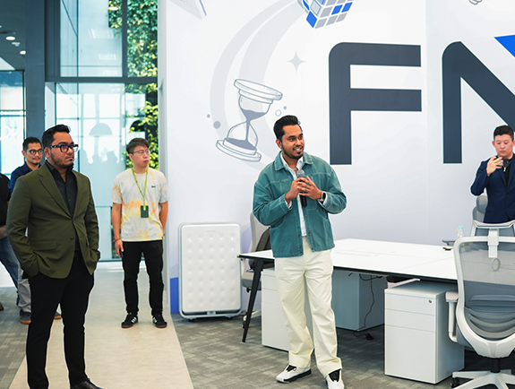 FundedNext Employee Speaking at Meeting in Conference Room